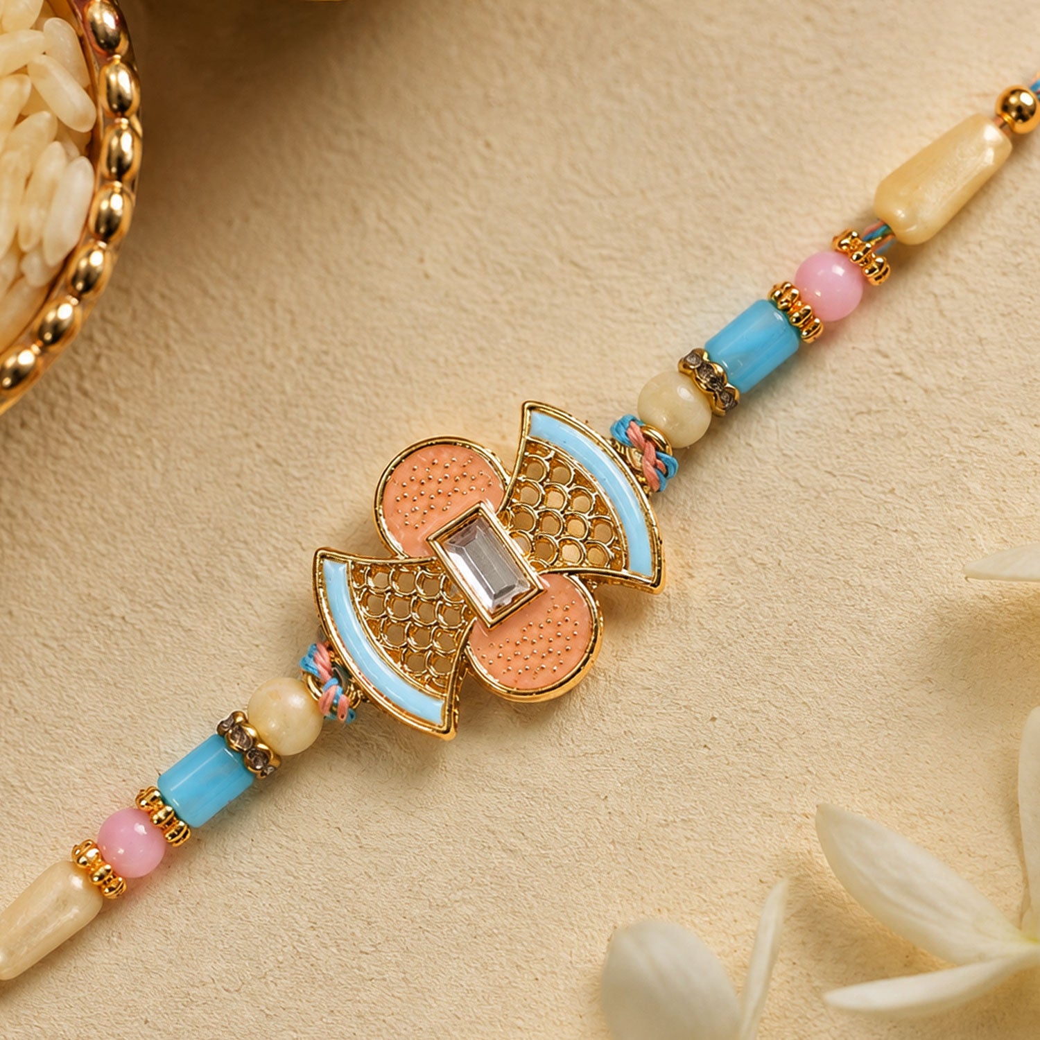 Fan Petal Kundan Pendant Rakhi with Pastel Beads