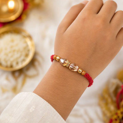 Red Thread Rakhi with Champagne Crystal Bead Pendant Accents