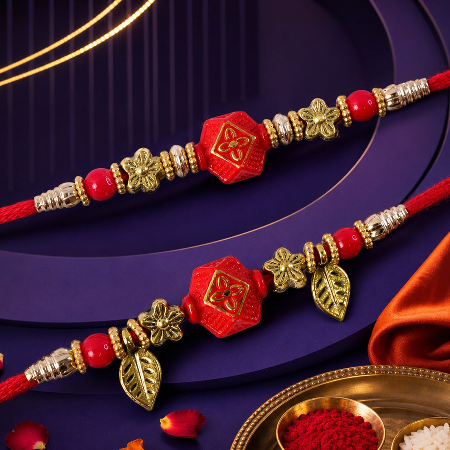 Couple Rakhi with Red Hexagon Charm, Gold Beads and Leaf Accents
