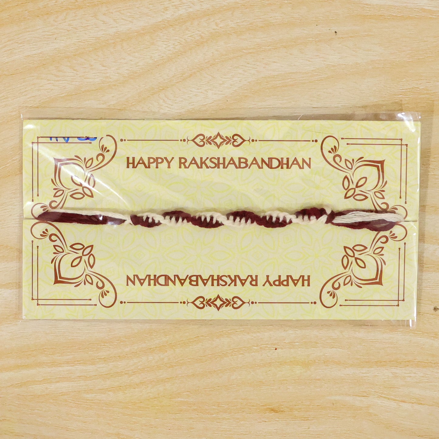 Maroon-White Twisted Cord Rakhi with Simple Beadless Design