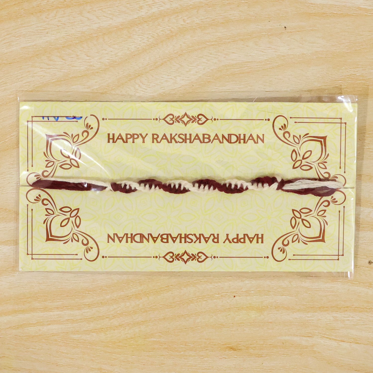 Maroon-White Twisted Cord Rakhi with Simple Beadless Design