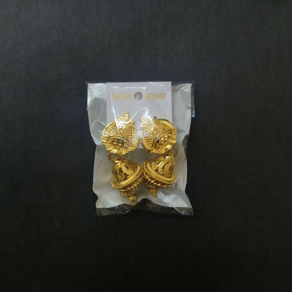 Gold tone jhumka earrings on a white background