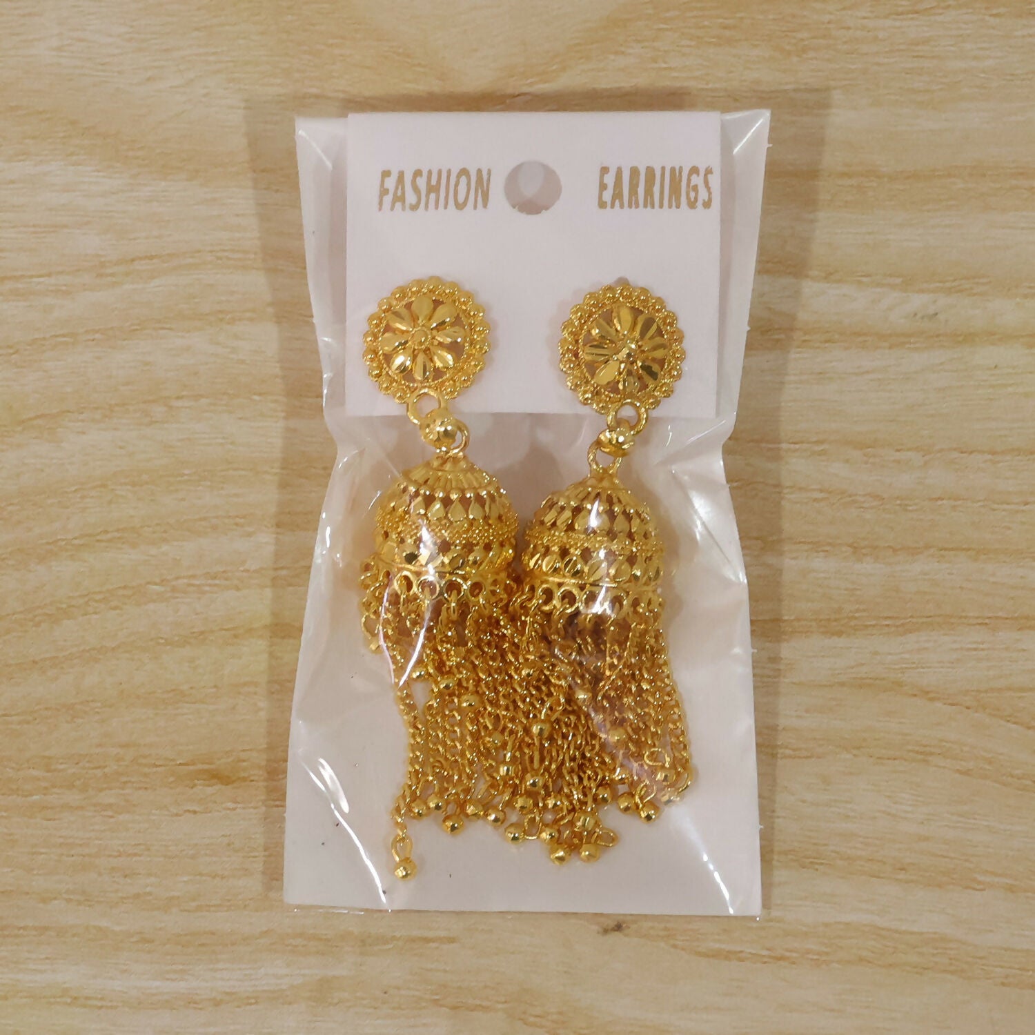 Elegant golden jhumka earrings showcasing craftsmanship