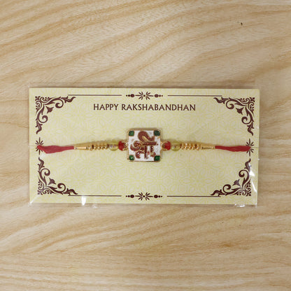 Shree Symbol Square Rakhi with Green Stones and Gold Beads