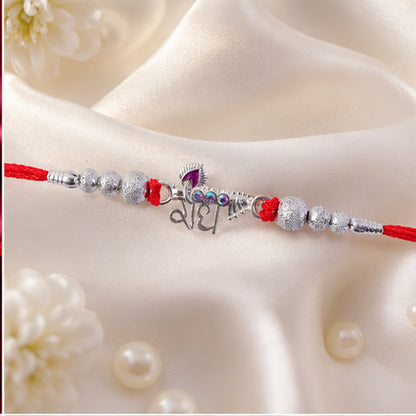 Elegant Radhe Silver Rakhi with Decorative Beads and Red Thread