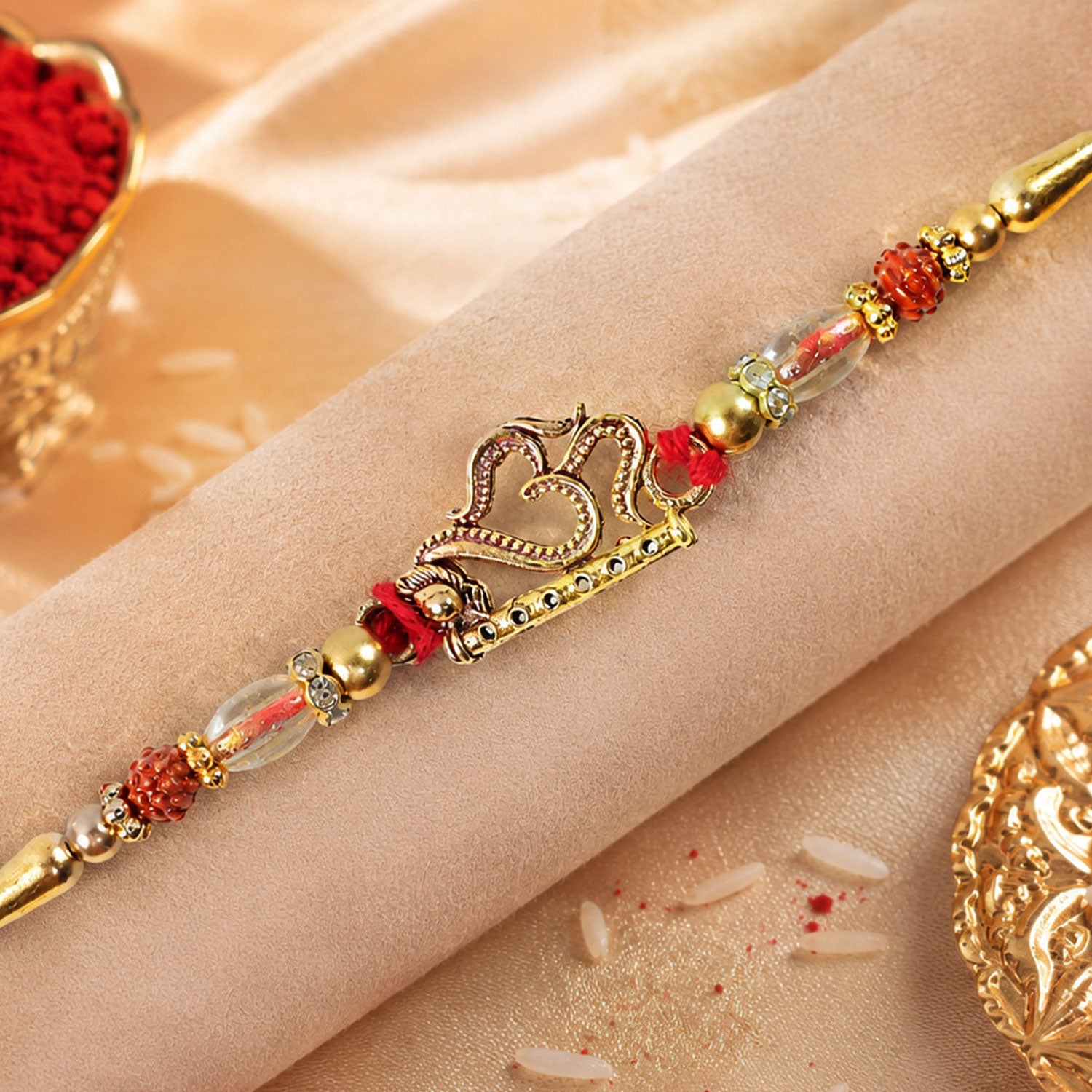 Om and Flute Pendant Rakhi with Rudraksha Beads