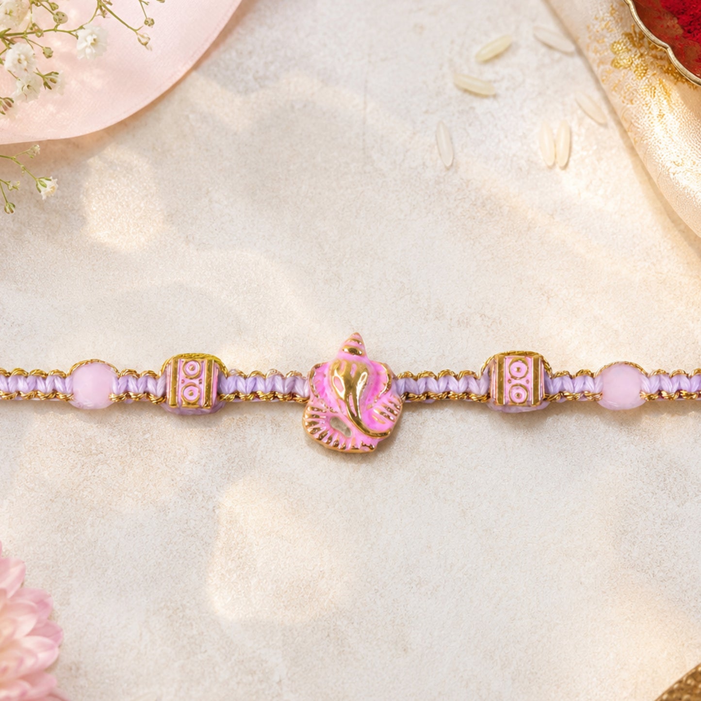Pink Bracelet Designer Rakhi with Pearl Style Beads and Soft Festive Finish