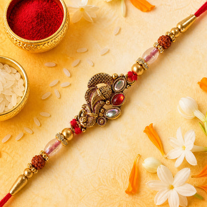 Elegant Rakhi with Ornate Floral Medallion and metal trims in chain look for Gift Use