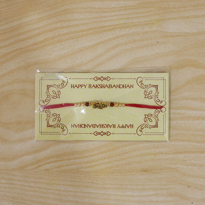 Shiv Trishul Damru Devotional Rakhi with Engraved Shiv Word, Golden Plate and Red Stones