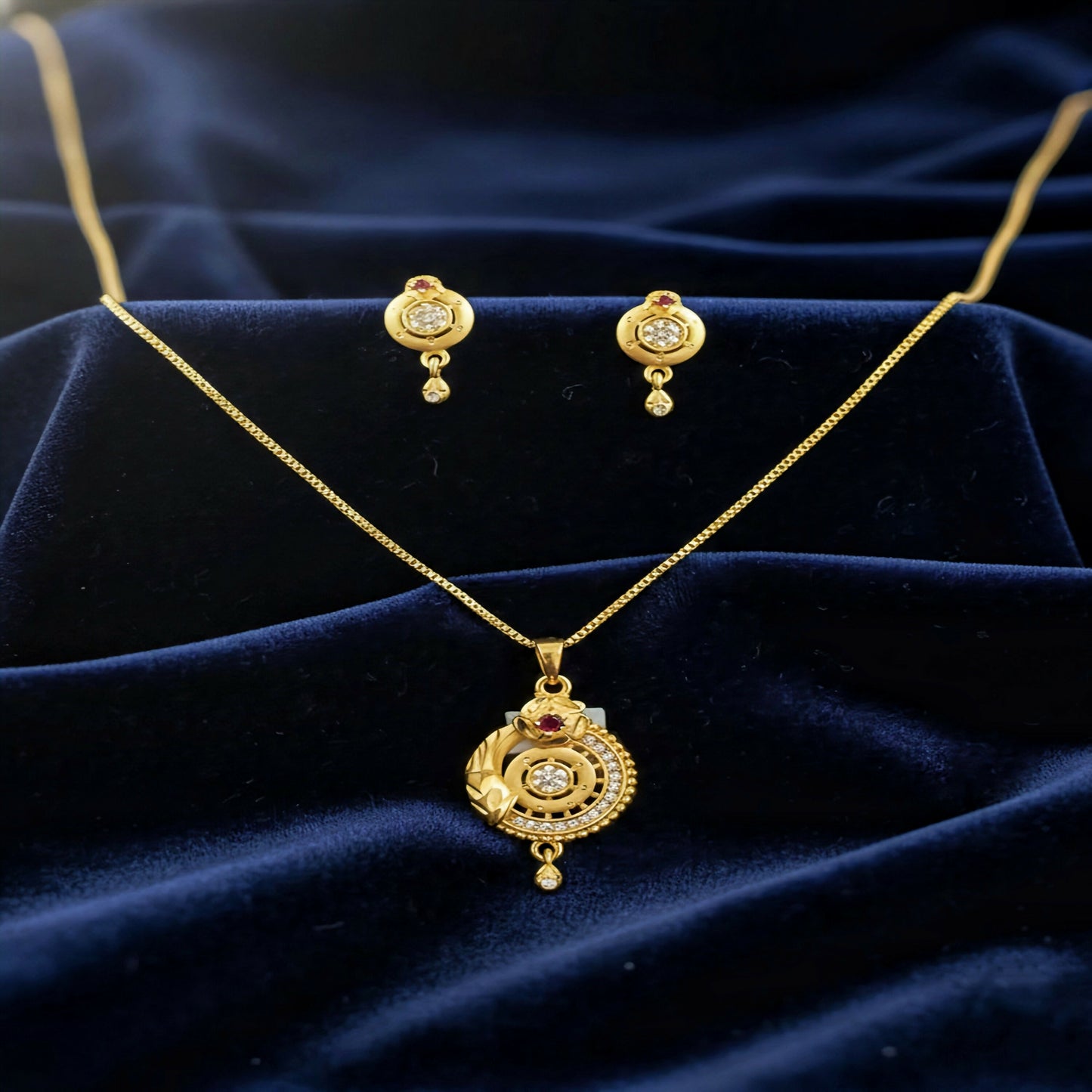 Gold-Plated Circular Pendant Necklace with Matching Drop Earrings – Floral Diamond & Ruby Accents