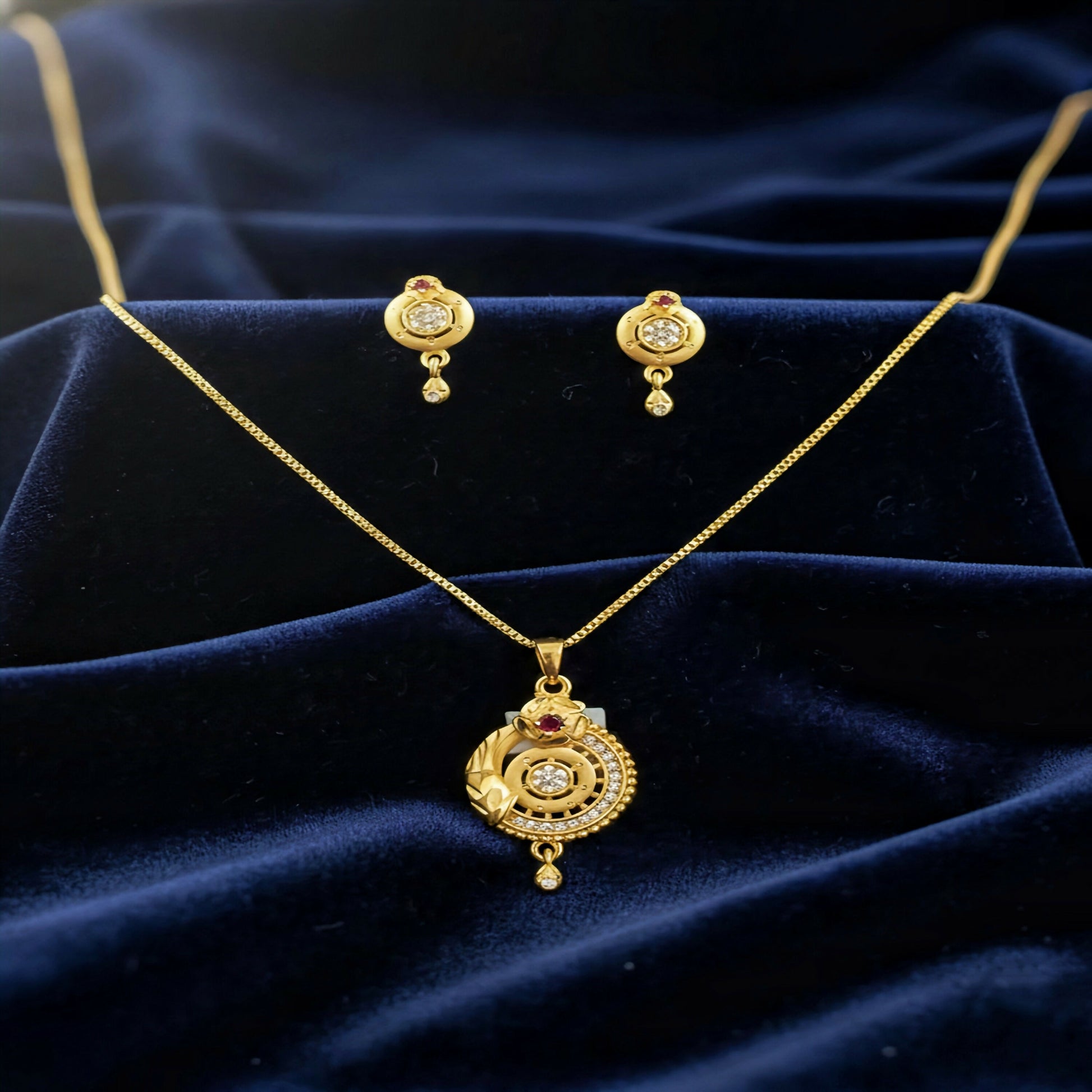 Gold-Plated Circular Pendant Necklace with Matching Drop Earrings – Floral Diamond & Ruby Accents