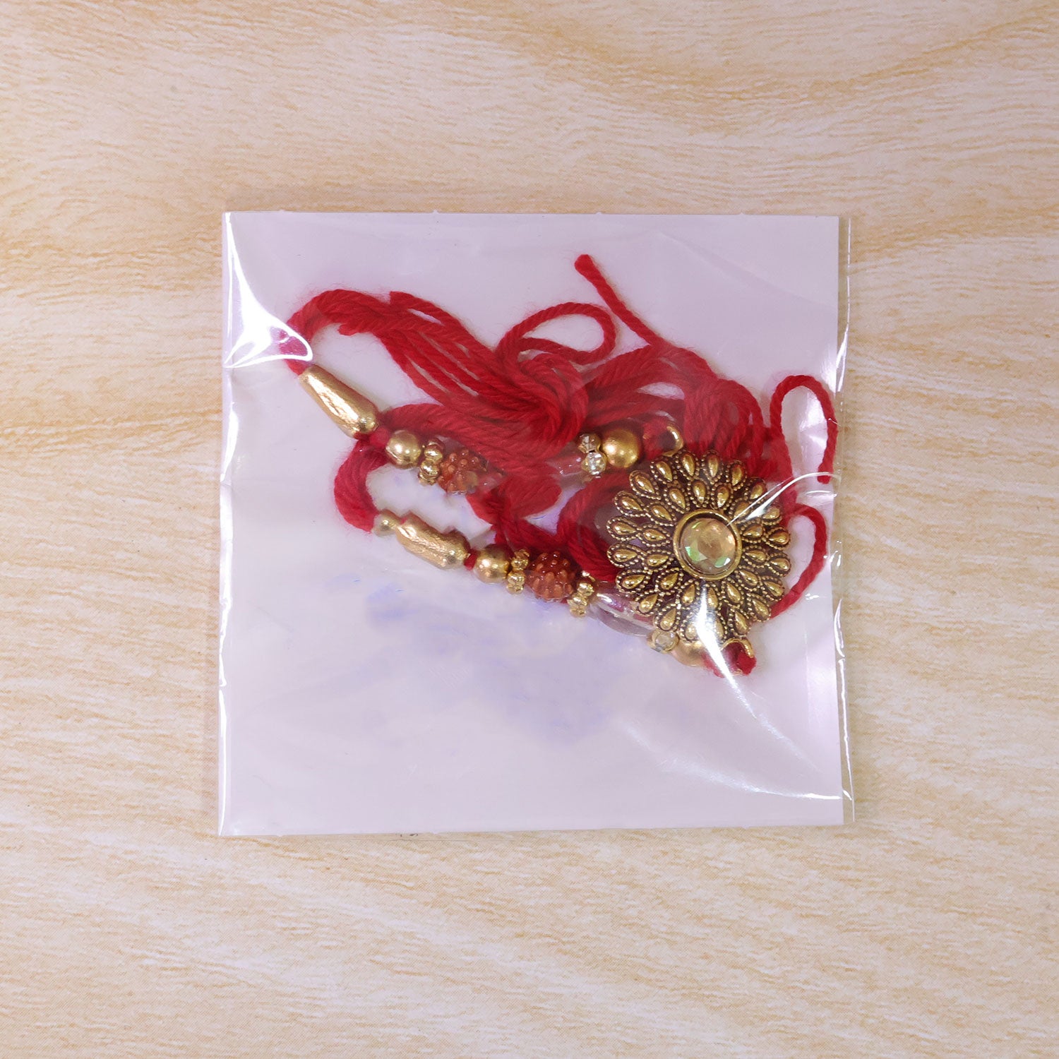 Oxidized Gold Floral Sunburst Pendant Rakhi with Rudraksha and Pearl Beads