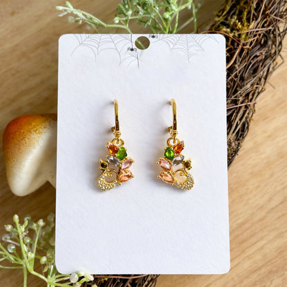 Multicolor gemstone leaf motif drop earrings with gold finish front view