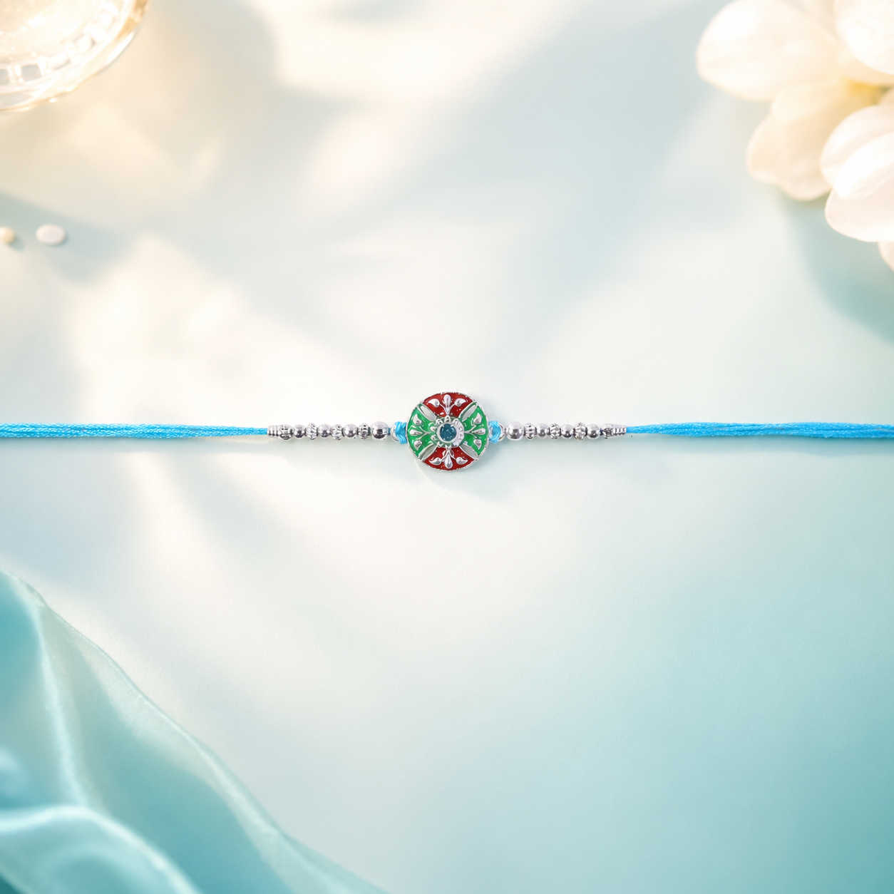 Blue Thread Rakhi with Multicolor Center and Fine Silver Chain