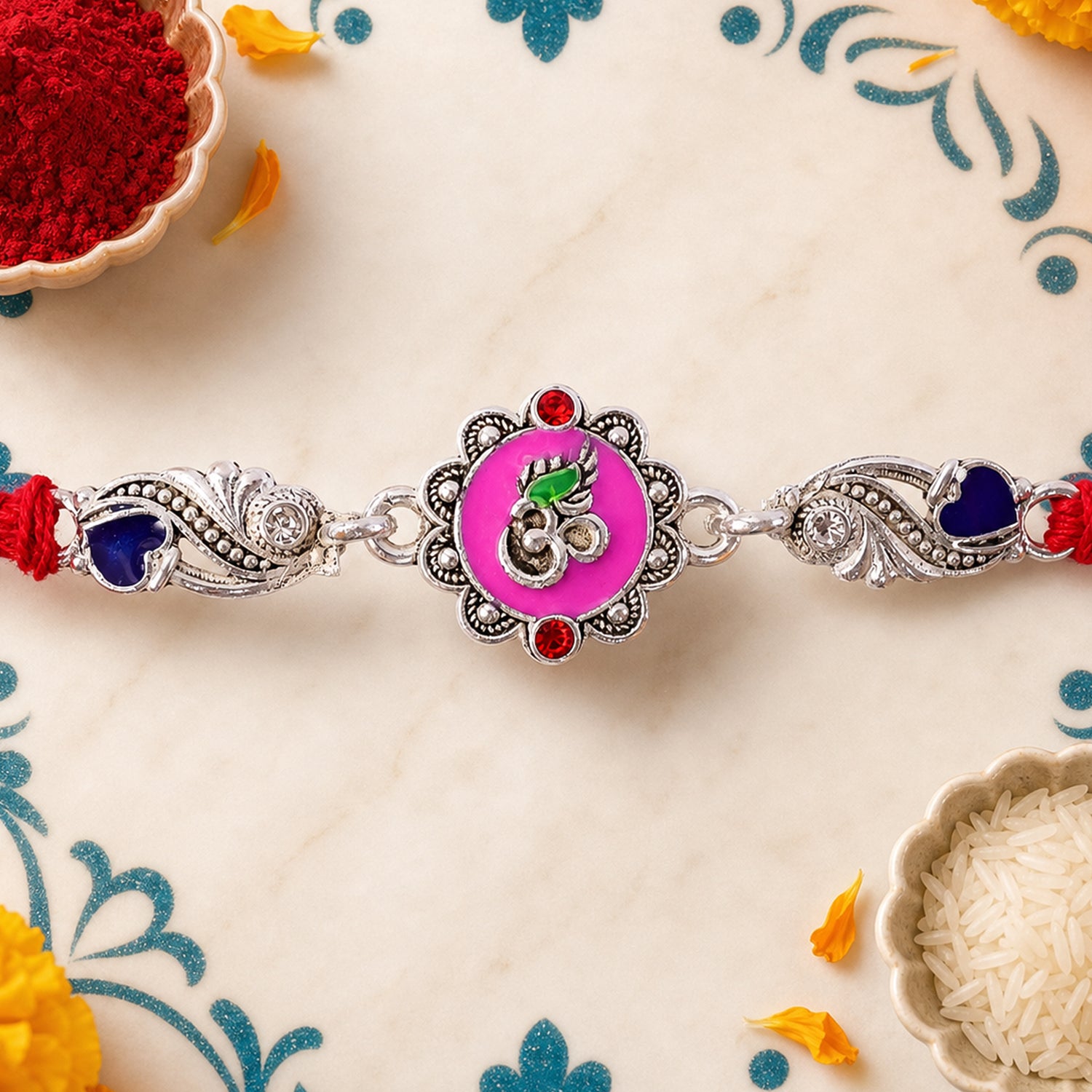 Premium Rakhi featuring Round Floral Medallion, gold trims and chain look for Gift