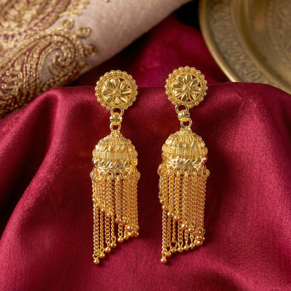 Front view of golden jhumka earrings with beaded tassels