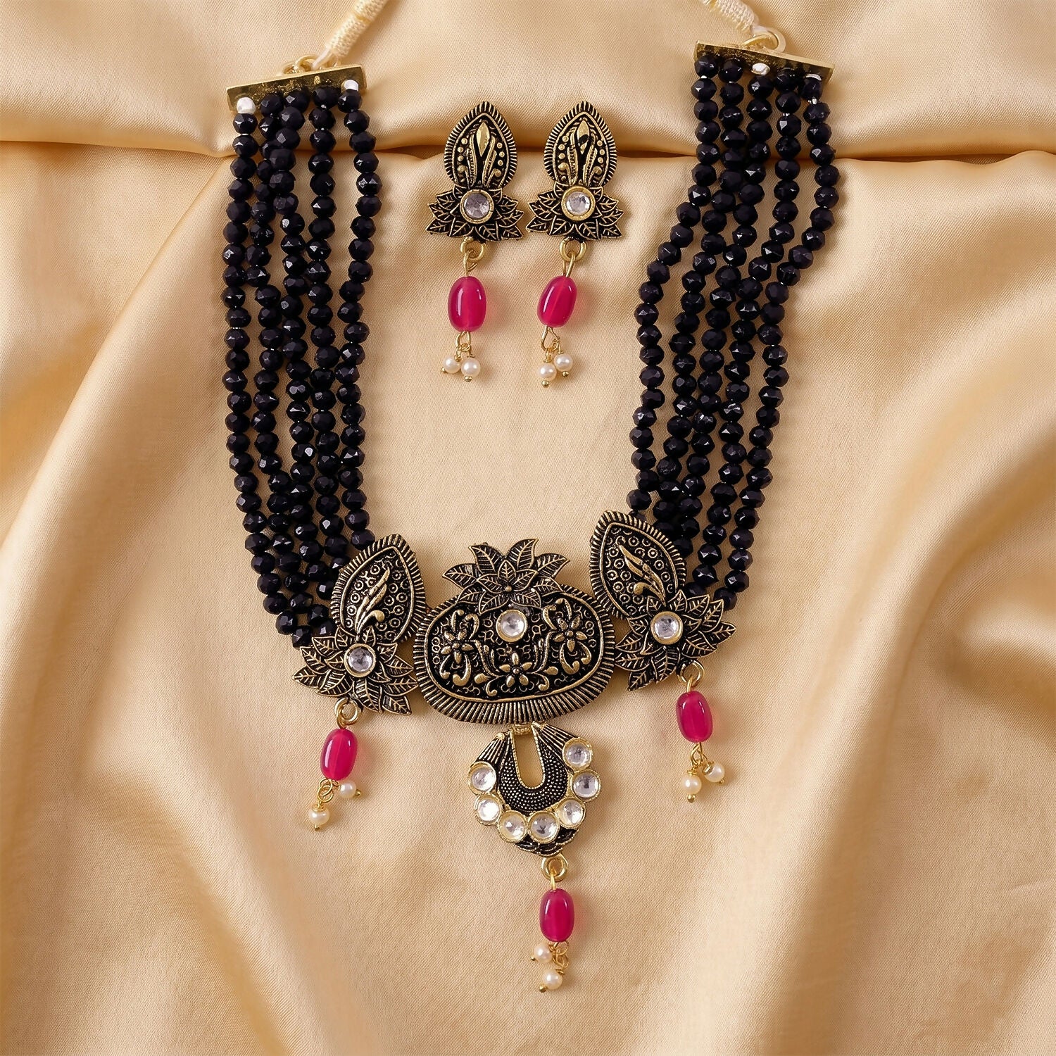 Adjustable thread closure on black beaded necklace