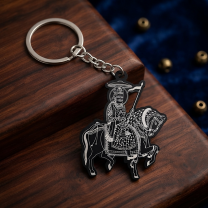 Traditional horse rider keychain with flag motif on a plain white surface