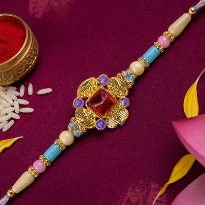 Ornate Rakhi showcasing Square Crystal Charm, gift finish and chain look for Gift Use