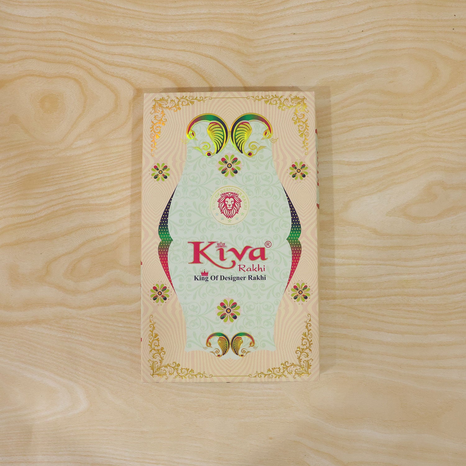 Silver Oval Floral Stone Rakhi with Color Petal Centre, Roli Chawal Coin and Card Packing