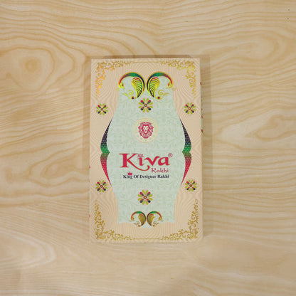 Silver Oval Floral Stone Rakhi with Color Petal Centre, Roli Chawal Coin and Card Packing