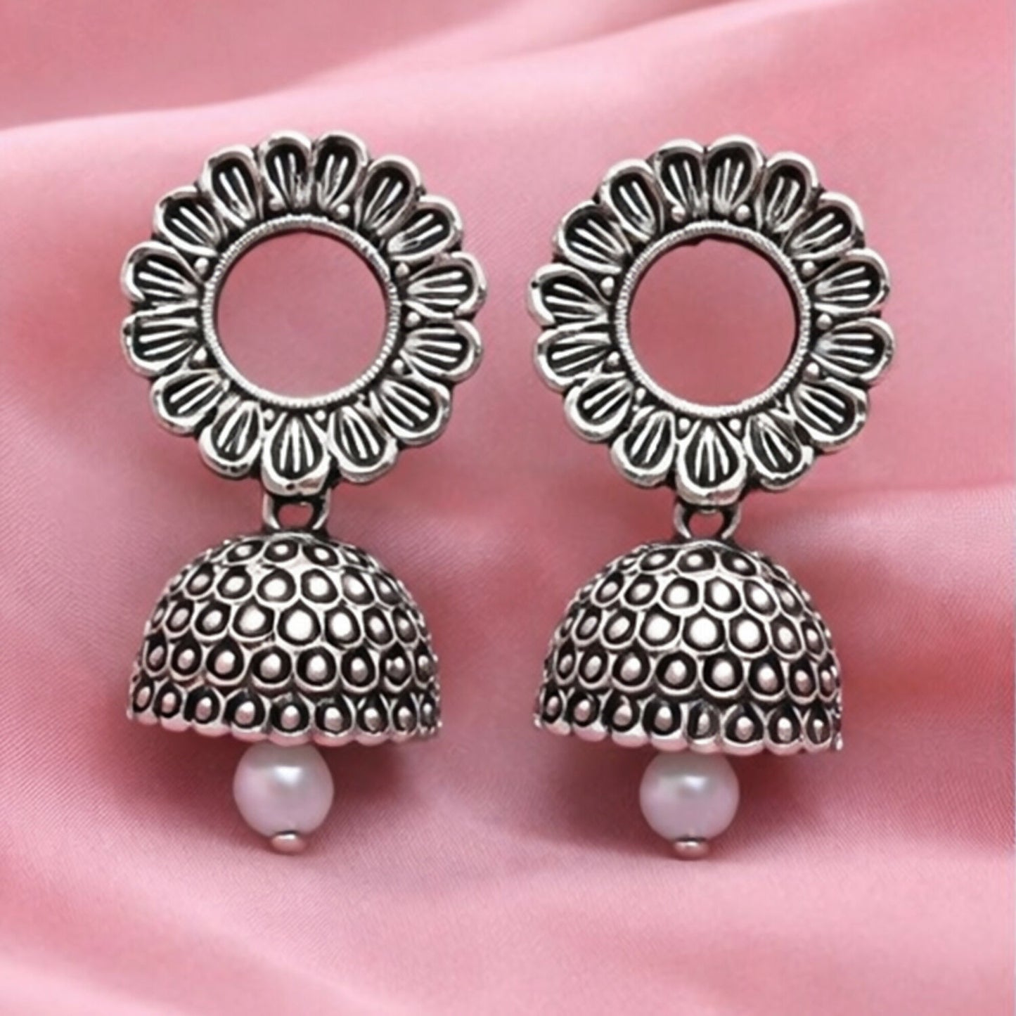Oxidized silver floral jhumka earrings front view showing traditional ethnic design