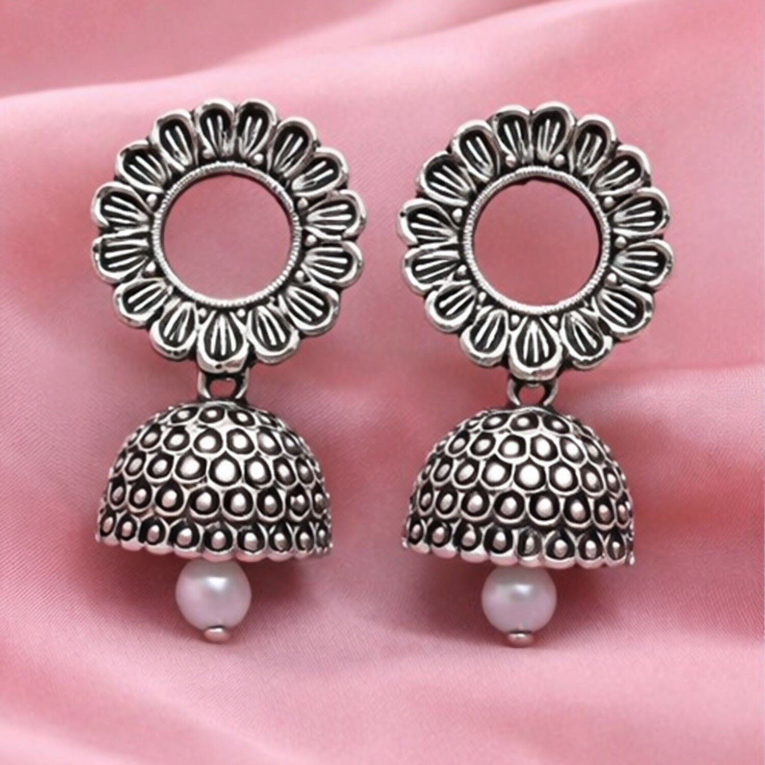 Oxidized silver floral jhumka earrings front view showing traditional ethnic design