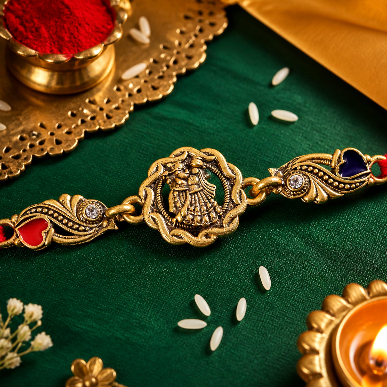 Antique Gold-Toned Radha Krishna Rakhi with Crystal Accents, Enamel Hearts & Red Thread