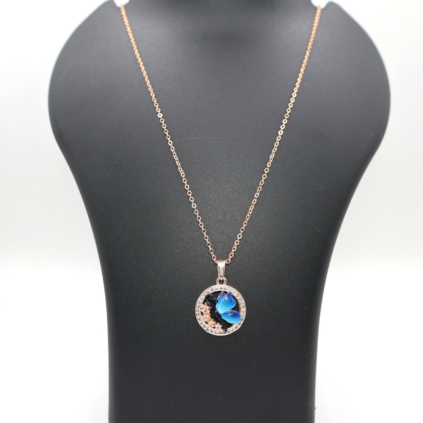 Stylish blue butterfly pendant necklace with rose gold plating on delicate chain