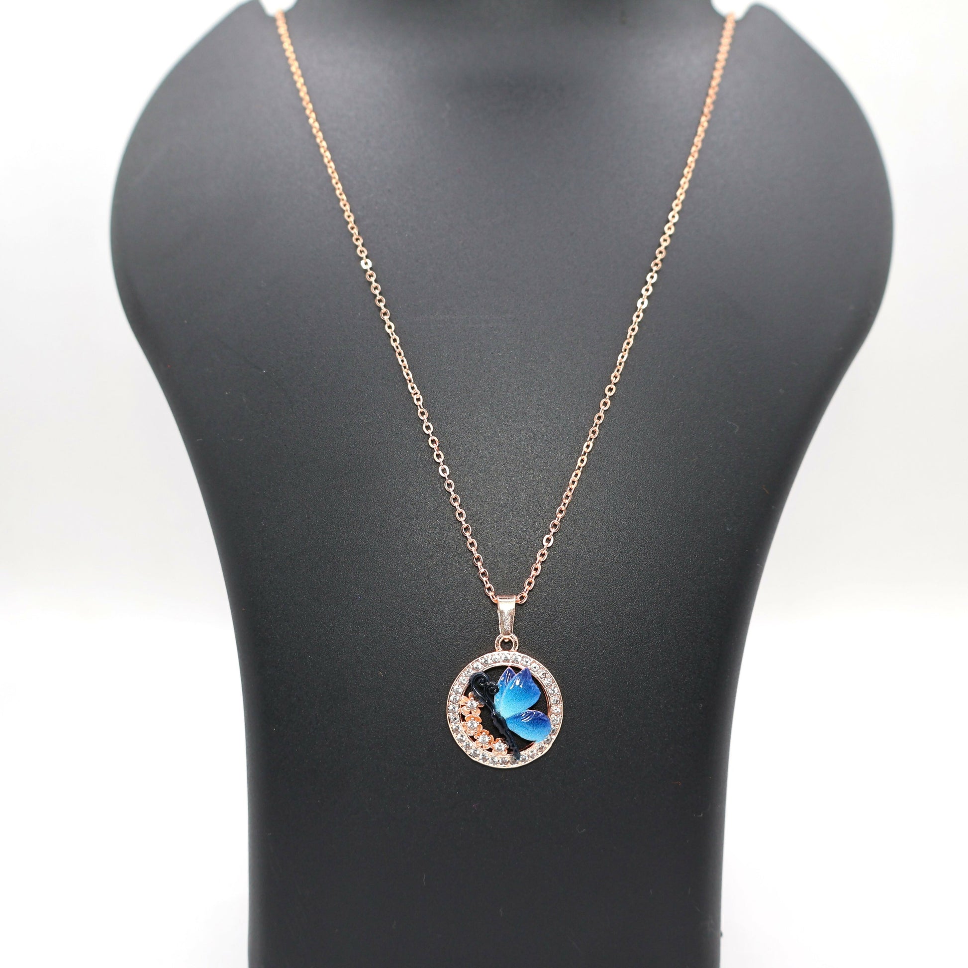 Stylish blue butterfly pendant necklace with rose gold plating on delicate chain