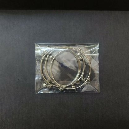 Kashmiri bangles worn on a woman's wrist