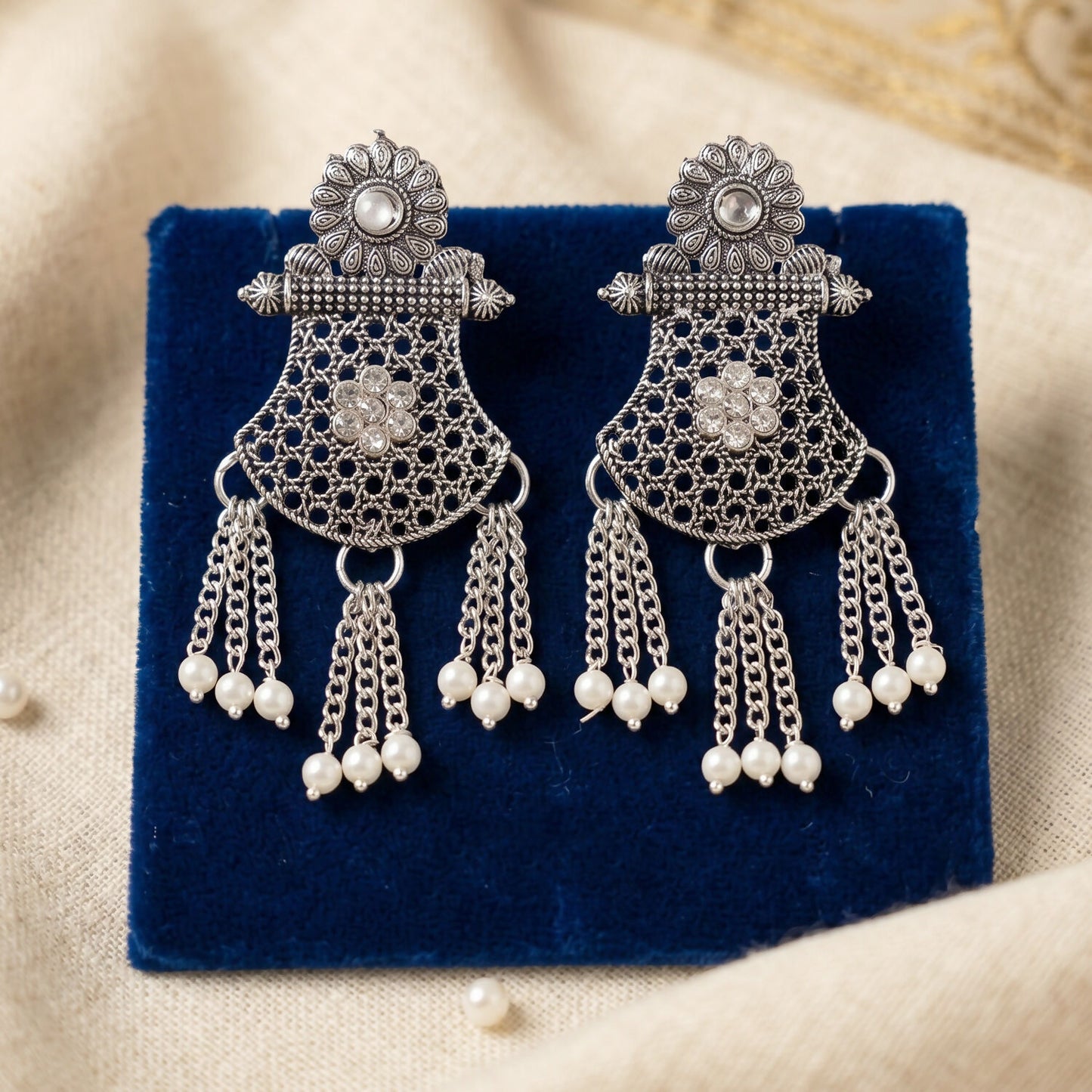 Matching silver earrings from the necklace set