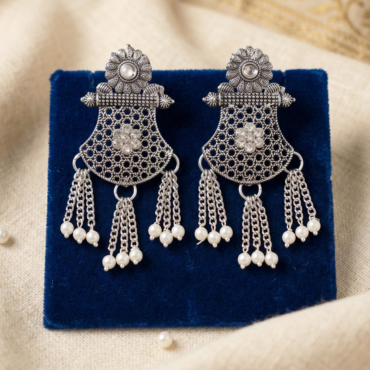 Matching silver earrings from the necklace set