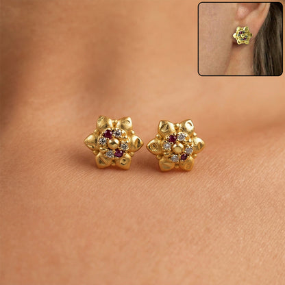 Traditional floral gold stud earrings with decorative stones in elegant design