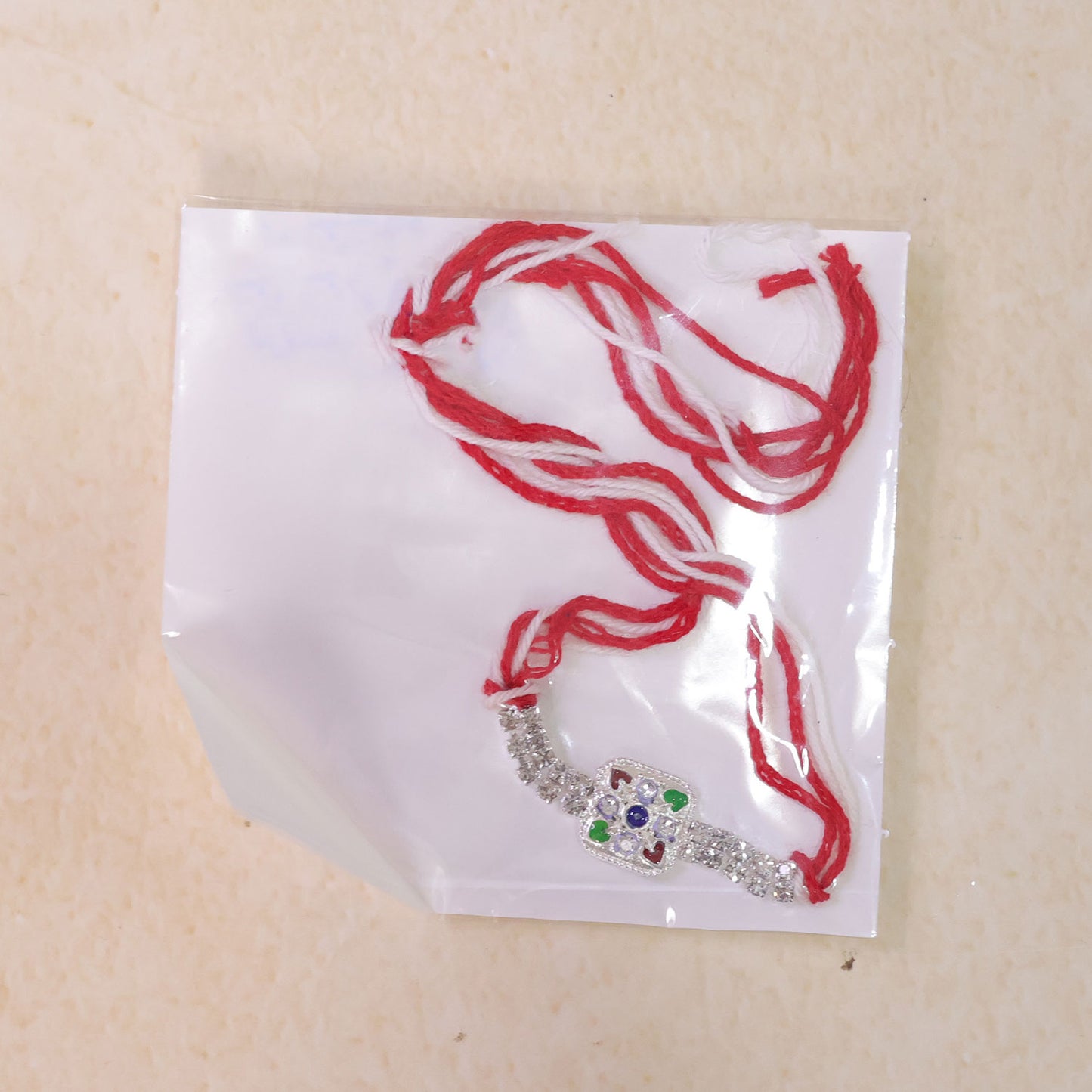 Premium Rakhi featuring Square Floral Charm, crystal accents and gift style for Gift