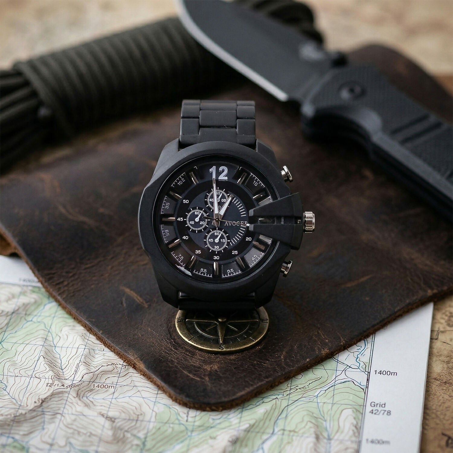 Black analog watch angled side view