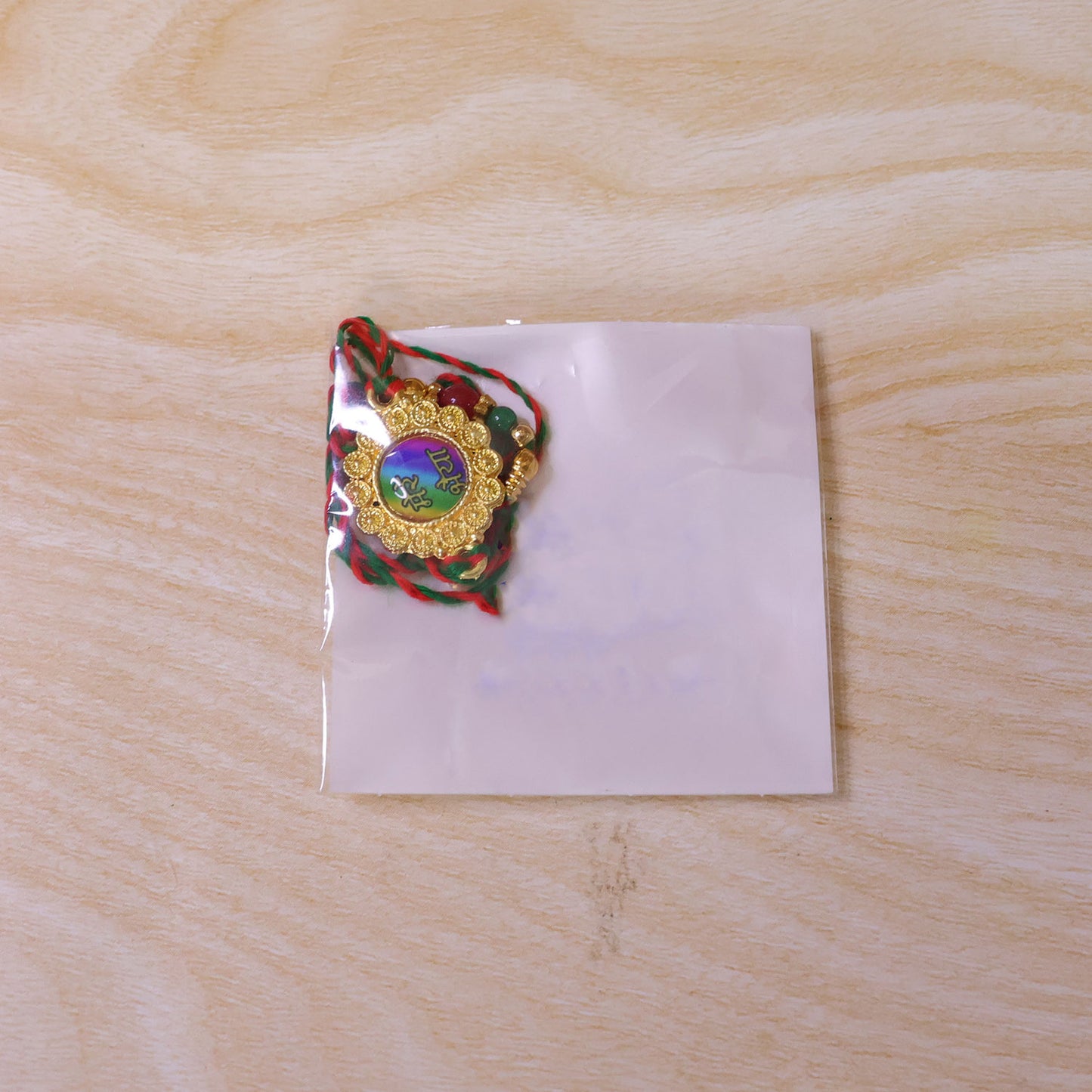 Bold Rakhi featuring Rainbow Devanagari Plaque, bead line and gift style for Gift Use