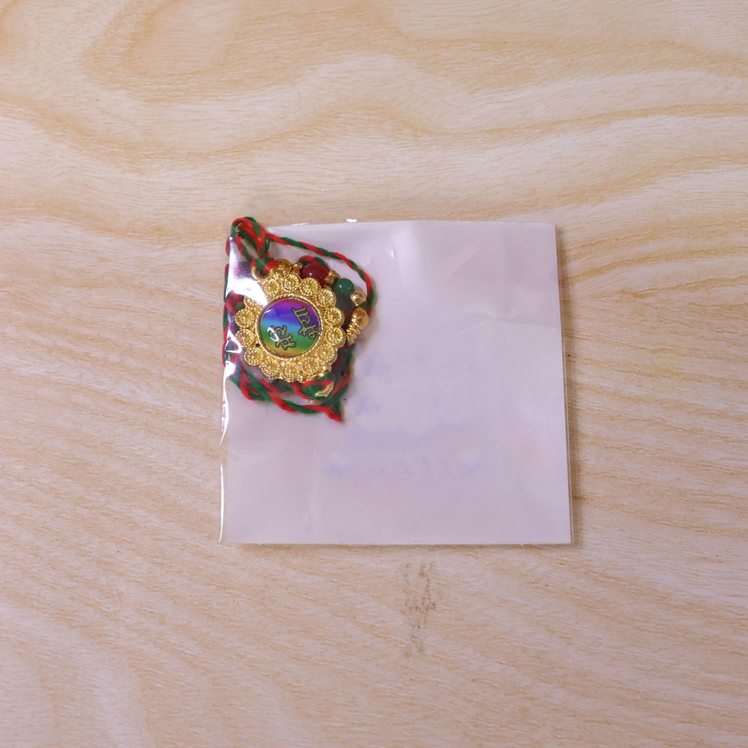 Bold Rakhi featuring Rainbow Devanagari Plaque, bead line and gift style for Gift Use