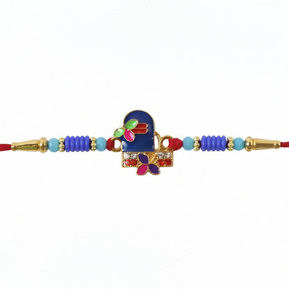 Hand tying Royal Blue Shiv Rakhi on wrist