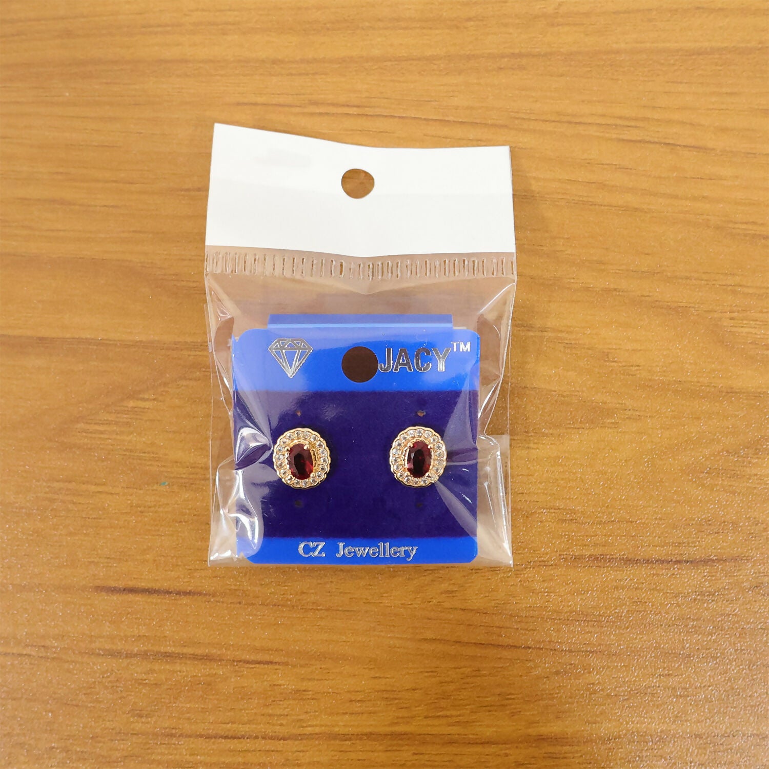 Elegant Oval Red Stone Stud Earrings with Crystal Halo Design