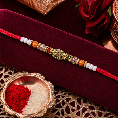 Red Thread Rakhi with Floral Gold Oval Charm and Multicolour Beads