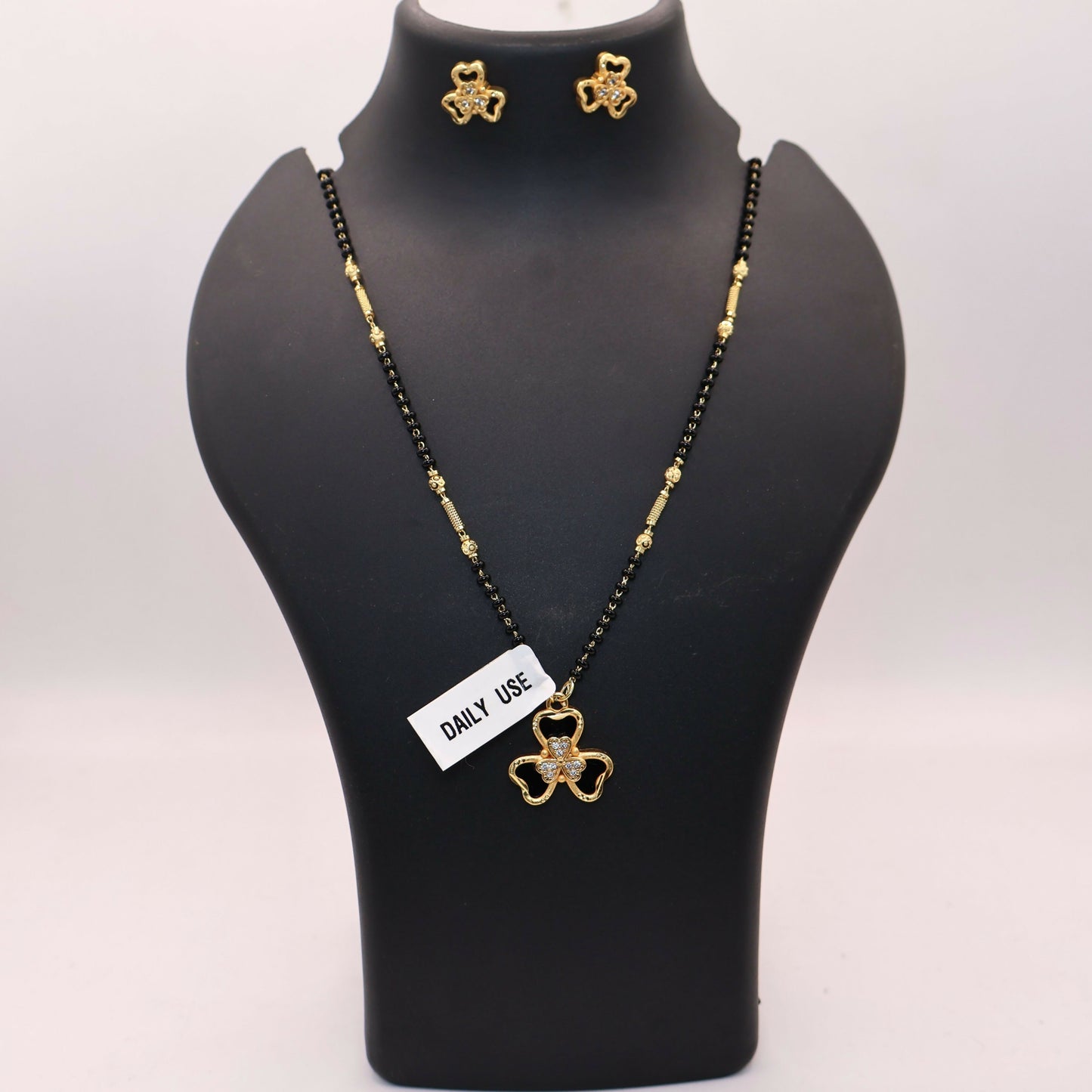 Gold-Plated AD Floral Mangalsutra Set with Clover Stud Earrings for women