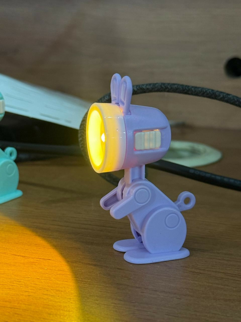 Bunny LED flashlight toy on a child's study desk