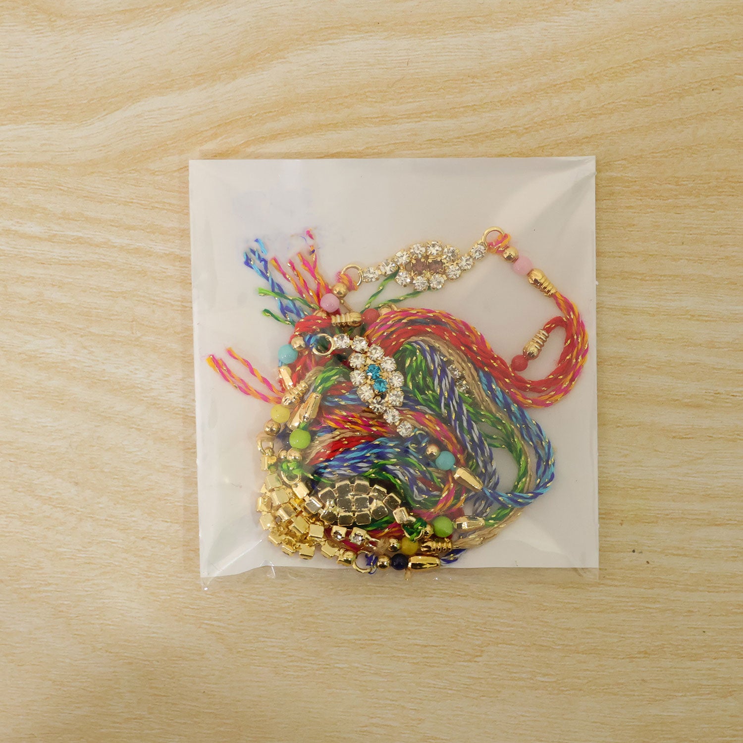 Oval Halo Motif Rakhi with AD Stones for Brother (Pack of 6)