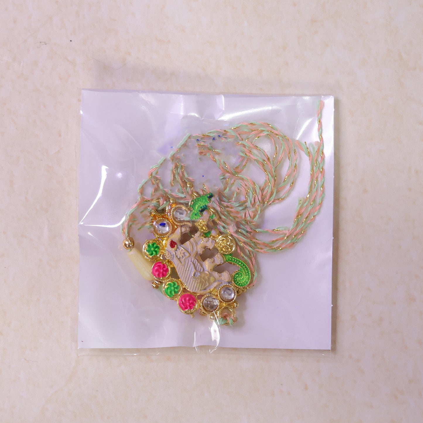 Festive Rakhi showcasing Elephant Charm, gold trims and display look for Gift Use