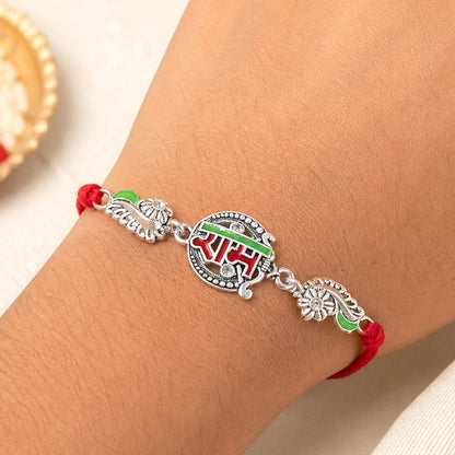 Silver-Toned Ram Rakhi with Red & Green Enamel and Crystal Accents for Brother