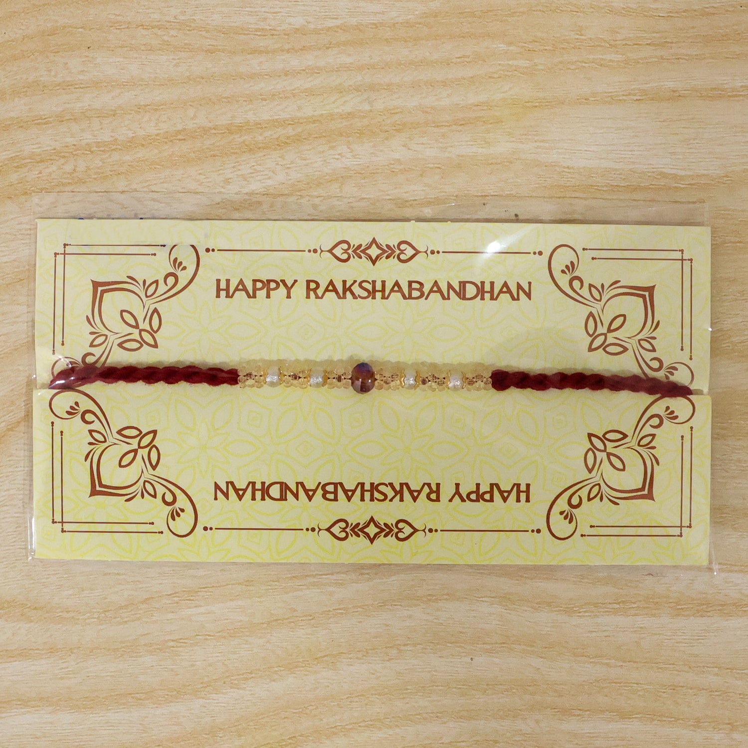 Graceful Pastel Bracelet Rakhi with Silver Centre and Delicate Raksha Bandhan Beauty