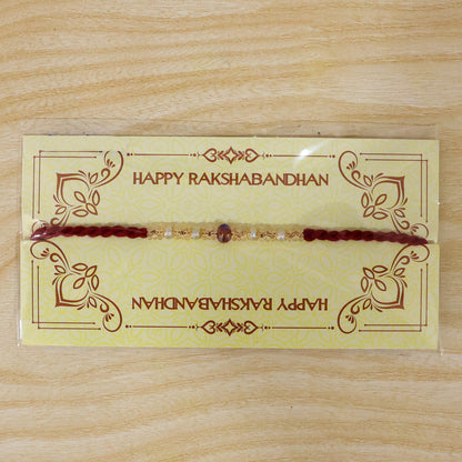 Graceful Pastel Bracelet Rakhi with Silver Centre and Delicate Raksha Bandhan Beauty