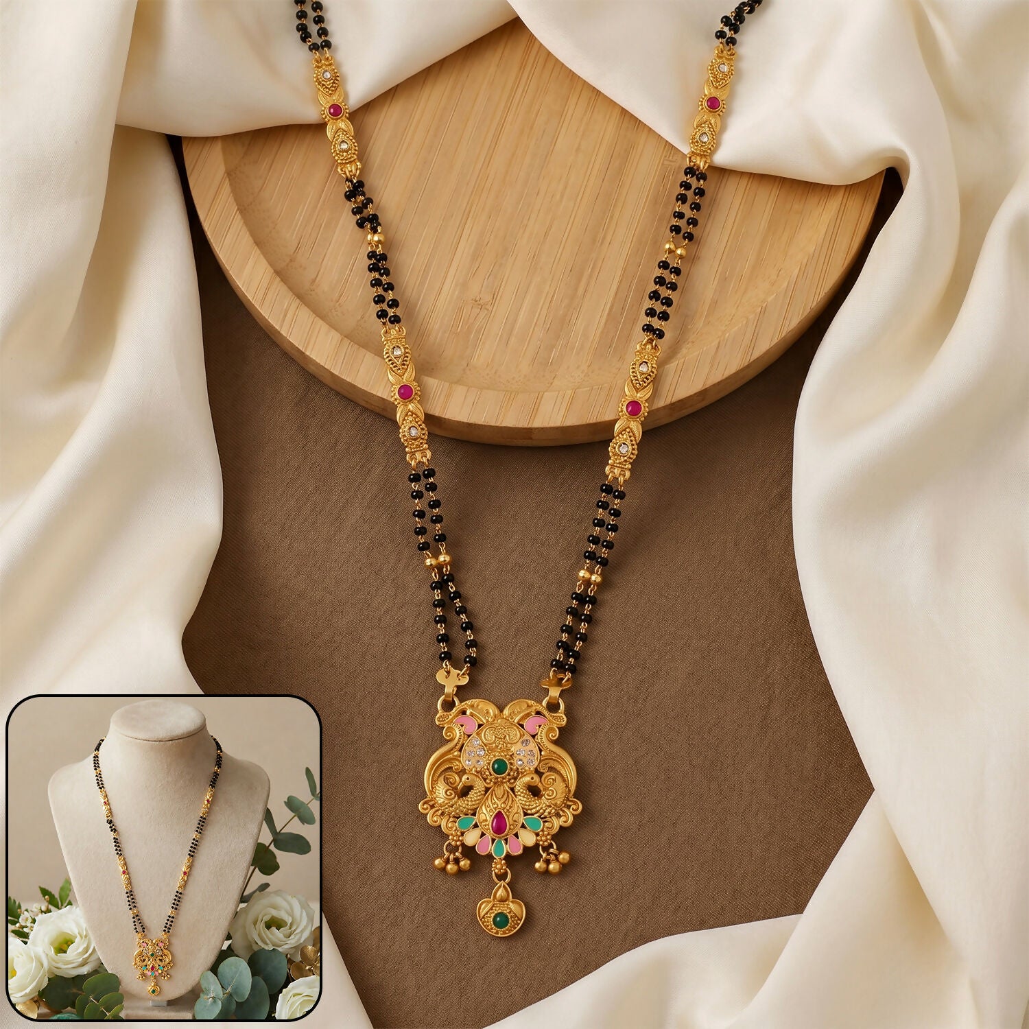 Close-up of antique finish Makara dragon scroll pendant with fan enamel base on mangalsutra chain