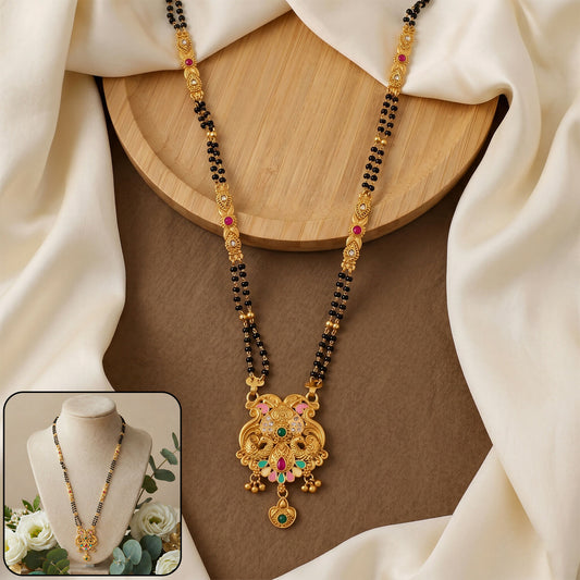 Close-up of antique finish Makara dragon scroll pendant with fan enamel base on mangalsutra chain